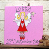 Picture of a cute fairy with red and white stripy socks a red dress and blond hair. Personalised with a name and date of birth. A lovely new baby gift