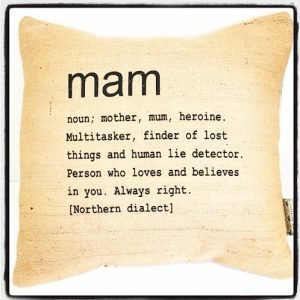 A cushion with Mam printed on it.