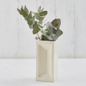 A white ceramic vase shaped like a house brick. Stamped with London Brick