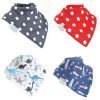 A boxed set of four dribble bibs suitable for age 0 to 3 years. Each bib has a different pattern; blue and white polka dot, red with white stars, dinosaurs and rockets