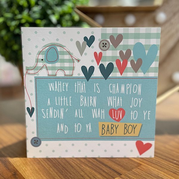 A new baby boy card with a cute blue elephant blue hearts and Wahey that is champoin a little bairn what joy sendin all wah luv to ye and to ya baby boy