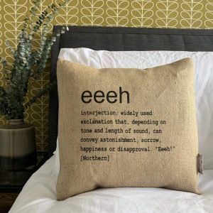 A North East inspired cushion made from hessian and backed with striped ticking. The cushion has a colloquial dictionary quote of what Eeeh means.