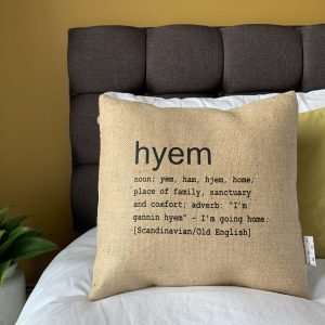 A North East inspired cushion made from hessian and backed with striped ticking. The cushion has a colloquial dictionary quote of what Hyem means.