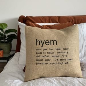 A North East inspired cushion made from hessian and backed with striped ticking. The cushion has a colloquial dictionary quote of what Hyem means.