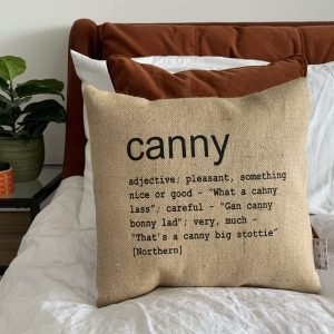 A North East inspired cushion made from hessian and backed with striped ticking. The cushion has a colloquial dictionary quote of what Canny means.