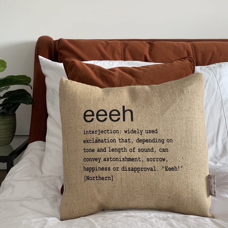 A North East inspired cushion made from hessian and backed with striped ticking. The cushion has a colloquial dictionary quote of what Eeeh means.