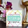 A card with a check pattern and happy birthday Husband ya a good un