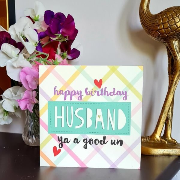 A card with a check pattern and happy birthday Husband ya a good un