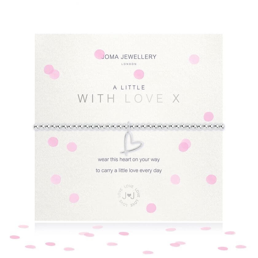 A silver plated elasticated bracelet from Joma with a silver heart outline hanging charm on a white sentimental comment card