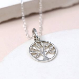 A sterling silver necklace with a tree of life pendant. The tree is enclosed in a circle and has textured leaves