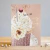 A birthday card with a cup cake