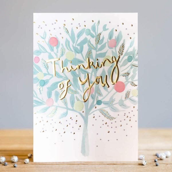 A grey tree with little flowers and thinking of you written in gold foil