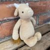A gorgeous, cute little cow, creamy brown in colour, with short white horns and a creamy snout. Floppy ears and a tubby belly makes this cow so sweet and huggable!