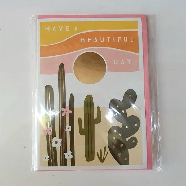 A birthday card with the words Have a beautiful day and images of cactus