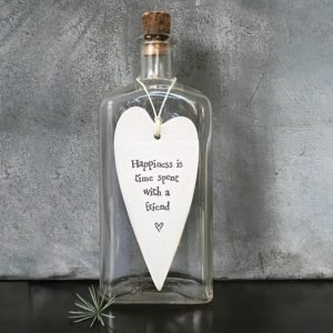 A long porcelain heart in cream with the sentiment, happiness is time spent with a friend stamped in to it in black