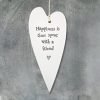 A decorative cream porcelain hanging heart stamped with the words Happiness is time spent with a friend. A lovely gift for a friend