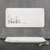 A long white porcelain trinket tray illustrated with plants and the words you are amazing,