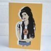 a greetings card featuring amy winehouse wearing a newcastle united football top