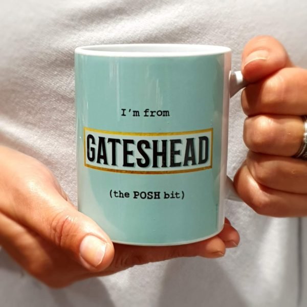A classic shaped mug printed with I'm from Gateshead (the POSH bit) with a blue background