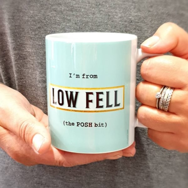 A classic shaped Blue Low Fell Posh Bit mug printed with I'm from Low Fell (the POSH bit) with a blue background