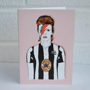Quirky greetings card for any occasion with an illustration of David Bowie wearing a newcastle united football top