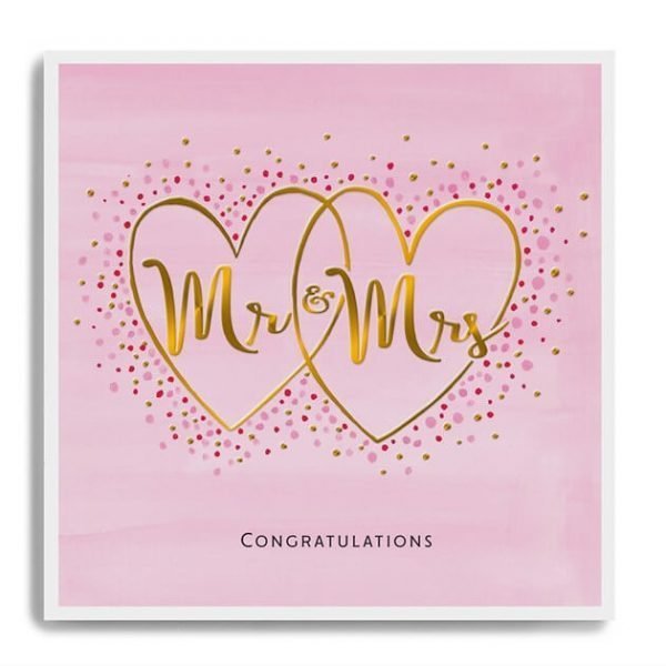 A pink card printed in embossed gold foil with Mr and Mrs and decorated with small gem stones