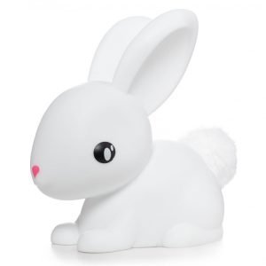 A white rubber bunny night liight with a pink nose and white fluffy bobtail.