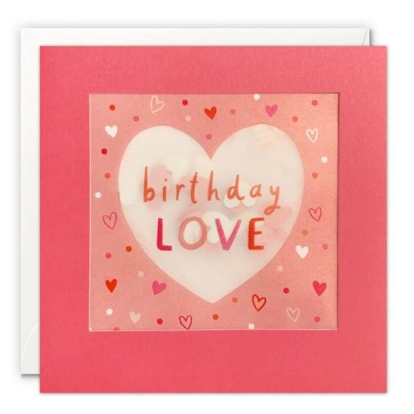 A square card with a pink border which holds in place a translucent packet which holds heart shaped confetti inside of it. A pink heart is printed on the translucent material along with the words Birthday Love.