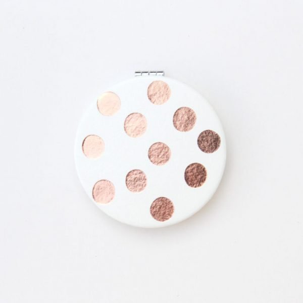 White leather look round pocket mirror with rose gold polka dots. Magnetic closing and 2 mirrors one is magnifying
