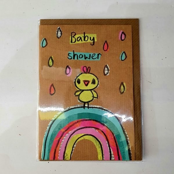 A baby shower greetings card with a childish crayon drawing of a chick standing in a rain shower on top of a rainbow