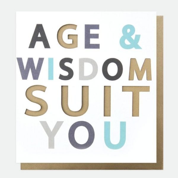 A designer typographic birthday card from Caroline Gardner. A white card with Age and Wisdom suit you in colourful letters with some of the letters being punched out.