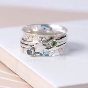 Spinning silver ring with semi precious stones