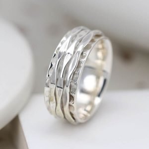 Sterling Silver hammered ring with silver spinning bands