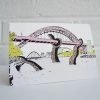 A greetings card with an illustration of a giant sea monster attacking the tyne bridge