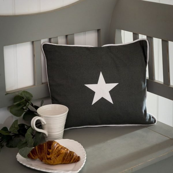 Grey star cushion. A grey linen cushion with a white star and white piping