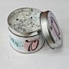 Scented candle in a tin. Classic cotton scented candle with glitter and sparkles added to the wax. The outside of the tin is illustrated with a 70 for a seventieth birthday present