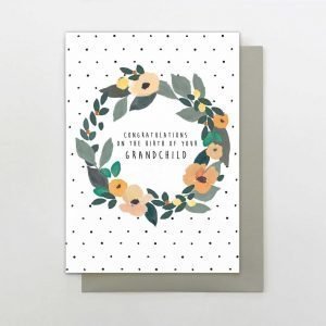 A card to congratulate the arrival on a new Grandchild. This card has flowers on a spotty background and the words "Congratulations on the birth of your Grandchild"