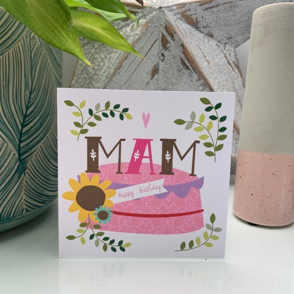 A card with Mam Happy Birthday and a cake and flower design