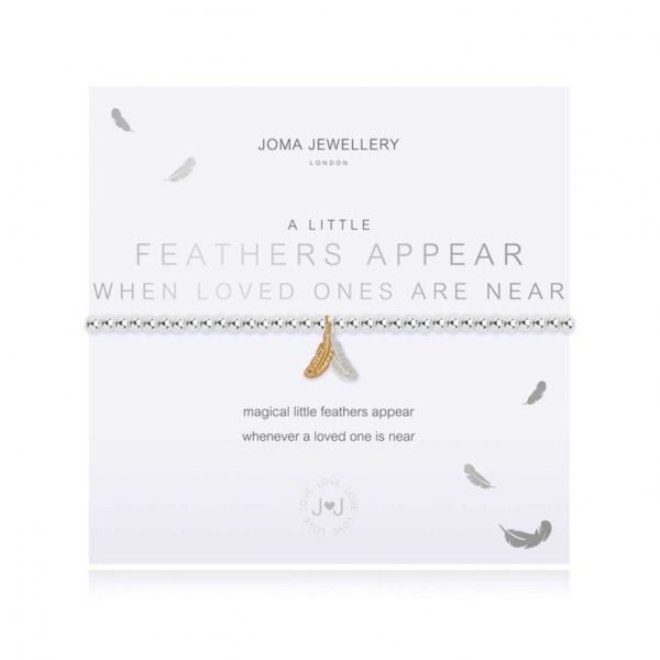 A silver plated bracelet with a a silver and gold feather charm on it. The bracelet is on a white card printed with the words Feathers Appear when Loved Ones are near.