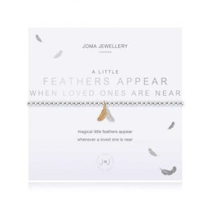 A silver plated bracelet with a a silver and gold feather charm on it. The bracelet is on a white card printed with the words Feathers Appear when Loved Ones are near.