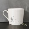 A cream ceramic mug with a black line drawing of a trees and flying birds and the words, May contain Gin. Comes in a gift box