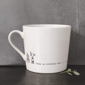 A cream ceramic mug with a black line drawing of a vase of flowers and the words, this is probably wine. Comes in a gift box