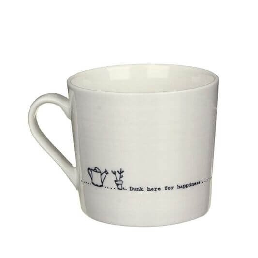 A cream mug with a black line drawing of a watering can and a potted plant and the words Dunk here for happiness