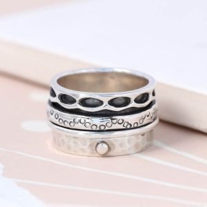 Hand crafted spinning ring made from fine quality sterling silver with decorative edges and double silver moving bands