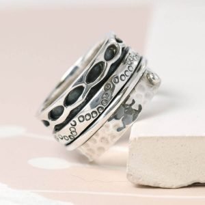 Hand crafted spinning ring made from fine quality sterling silver with decorative edges and double silver moving bands