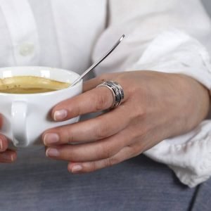 Hand crafted spinning ring made from fine quality sterling silver with decorative edges and double silver moving bands