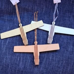 A wooden Angel of the North hanging tree decoration in a choice of silver, gold or burnt gold