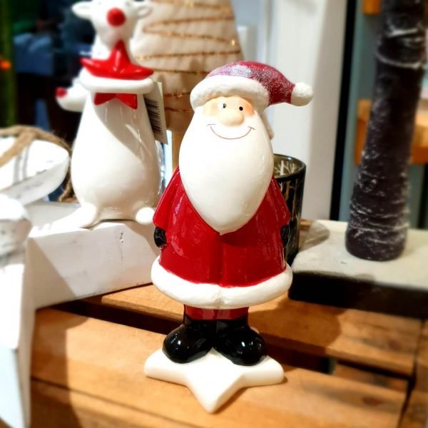 A ceramic standing Santa decoration
