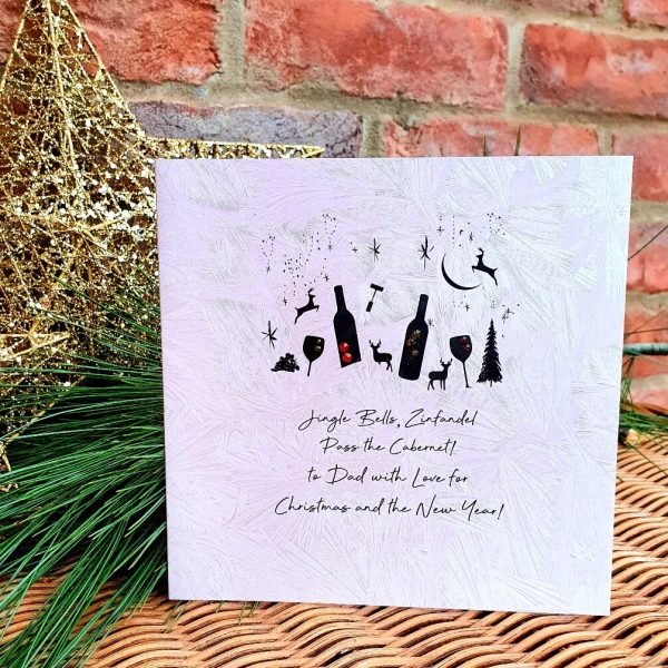 A beautiful luxury hand made Christmas card from Five Dollar Shake. With images of all things red wine related, bottles, openers, glasses with Christmas trees, stars, snowflakes and deer. Finished with crystals and the words Jingle Bells, Zinfandel, pass the Cabernet! To Dad with love for Christmas and the New Year.