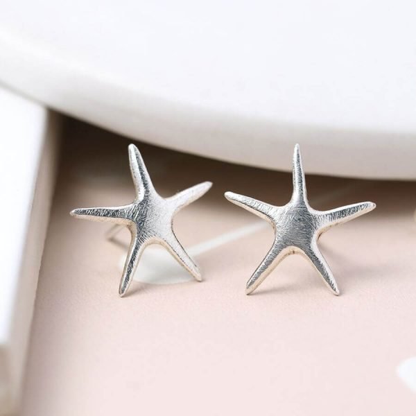 Brushed silver starfish earrings.